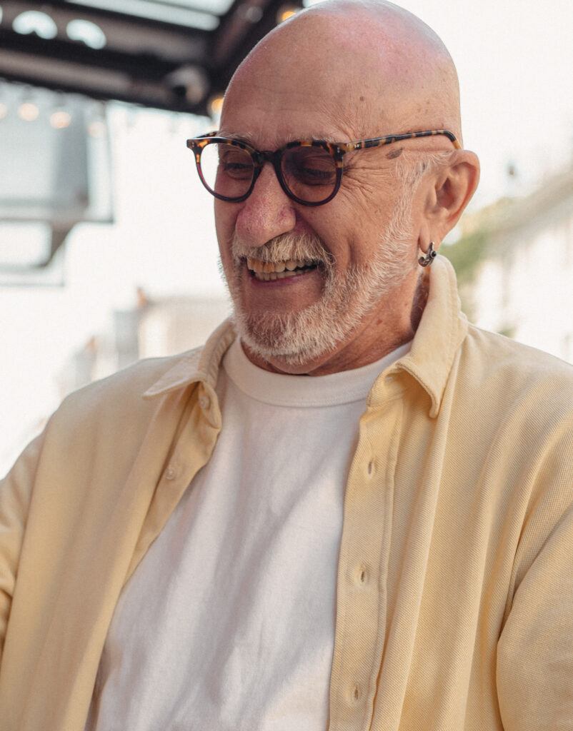 Older man with sunglasses laughing